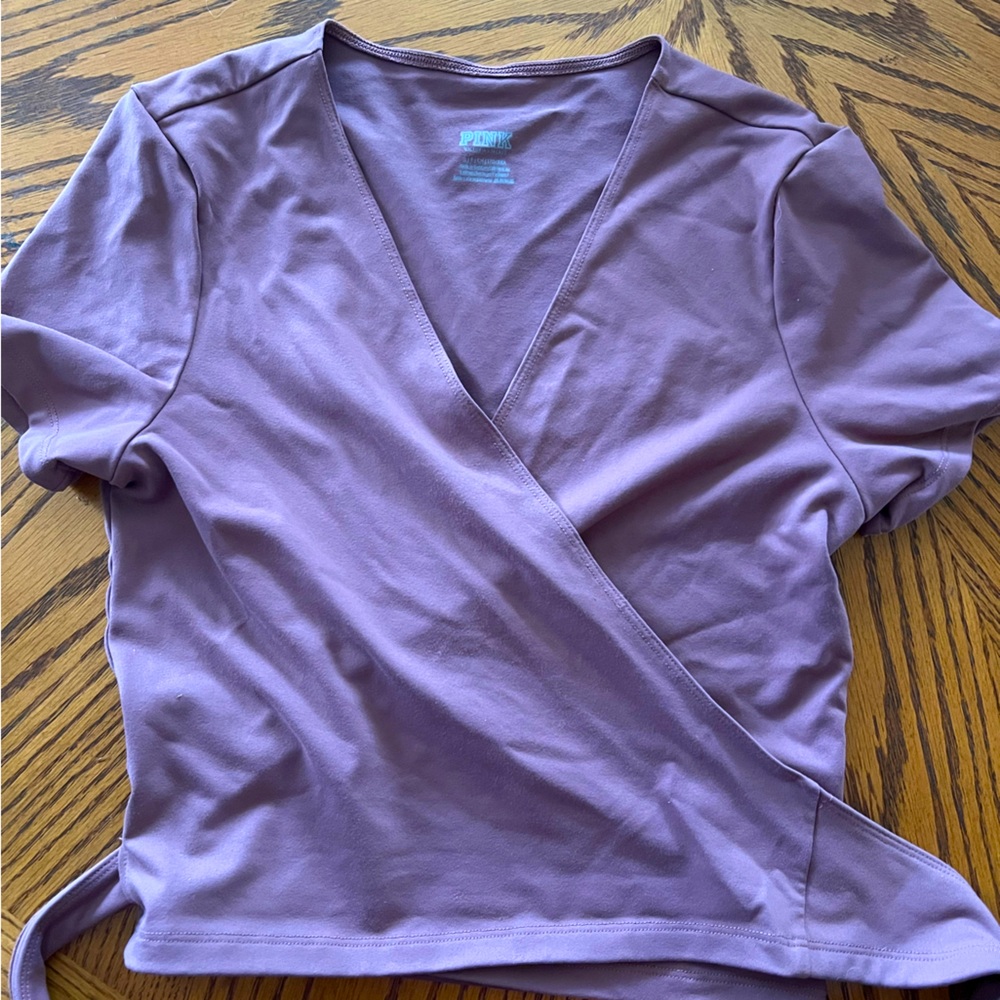 Pink wrap around sports shirt